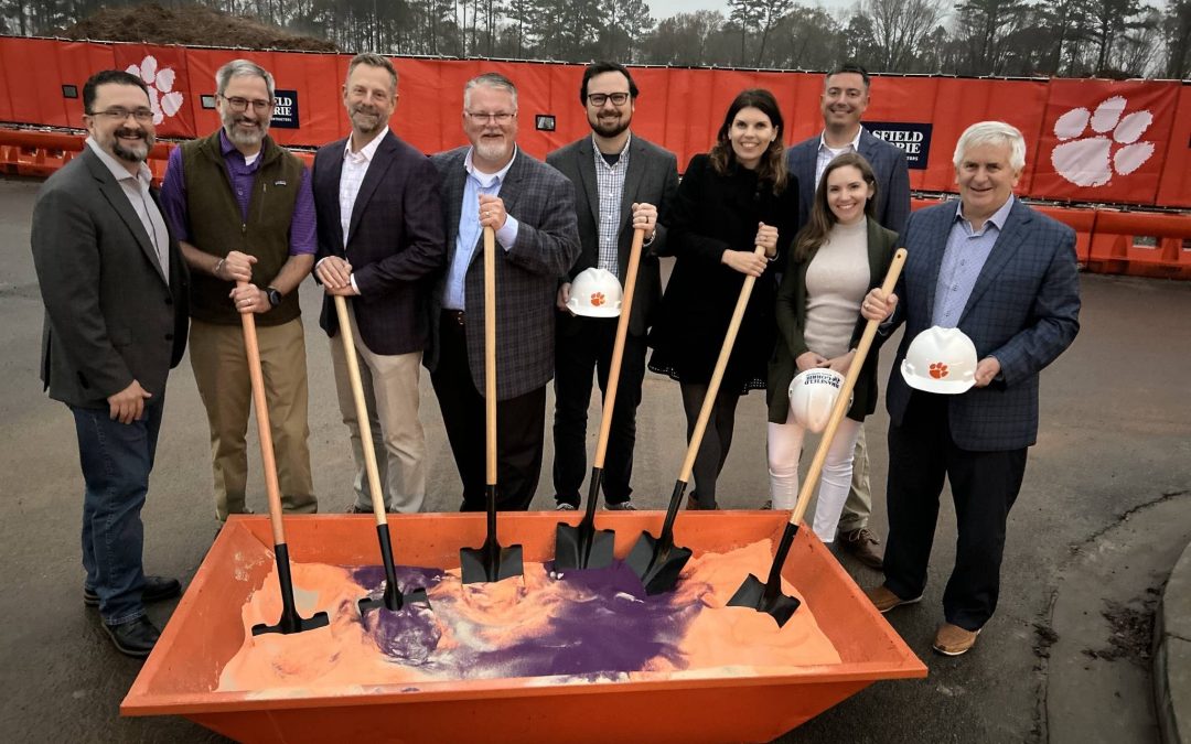 designers from Garvin Design Group and HNTB holding shovels at the groundbreaking for Clemson's Women's Sports Program Expansion