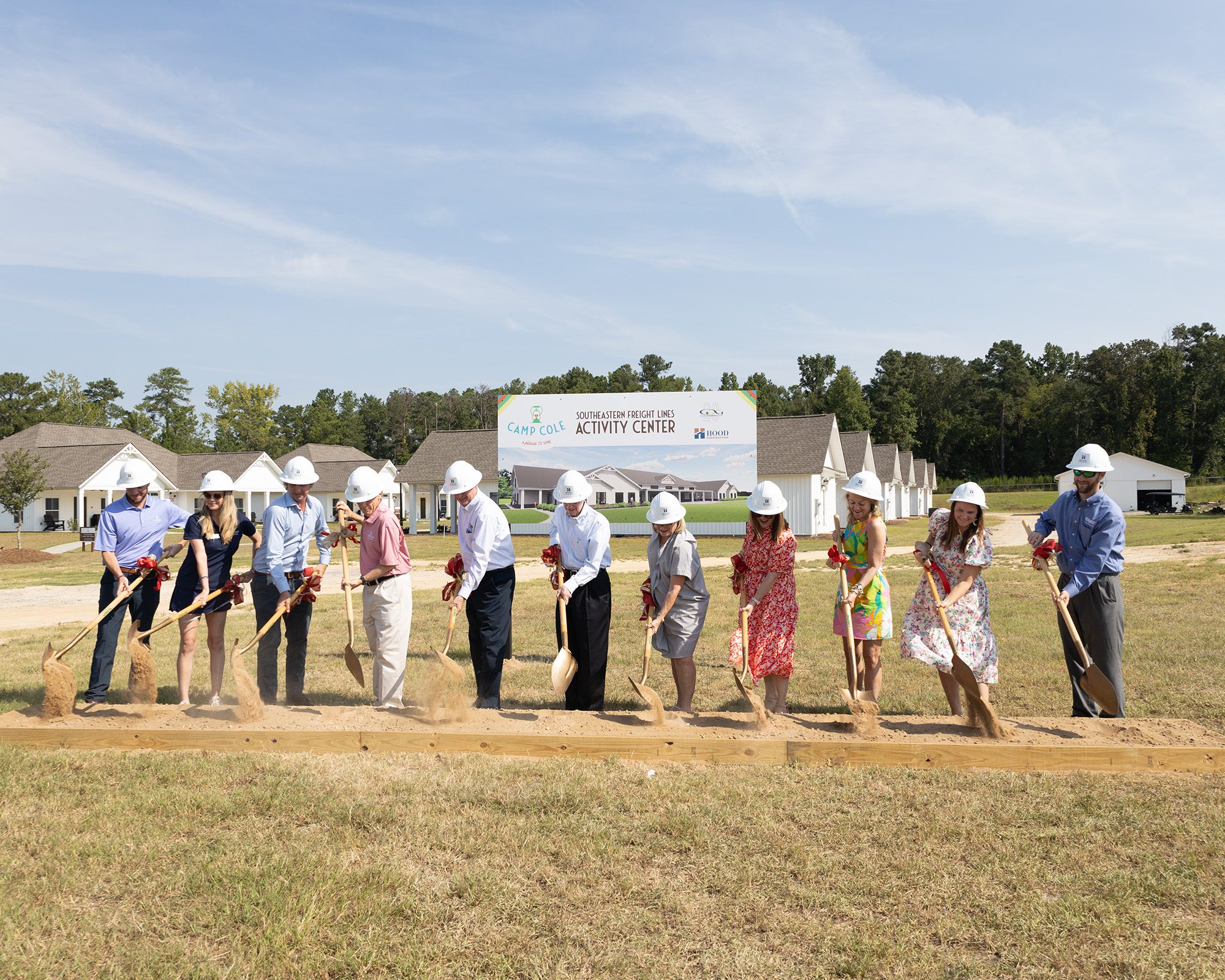 designers from Garvin Design Group and HNTB holding shovels at the groundbreaking for Clemson's Women's Sports Program Expansion